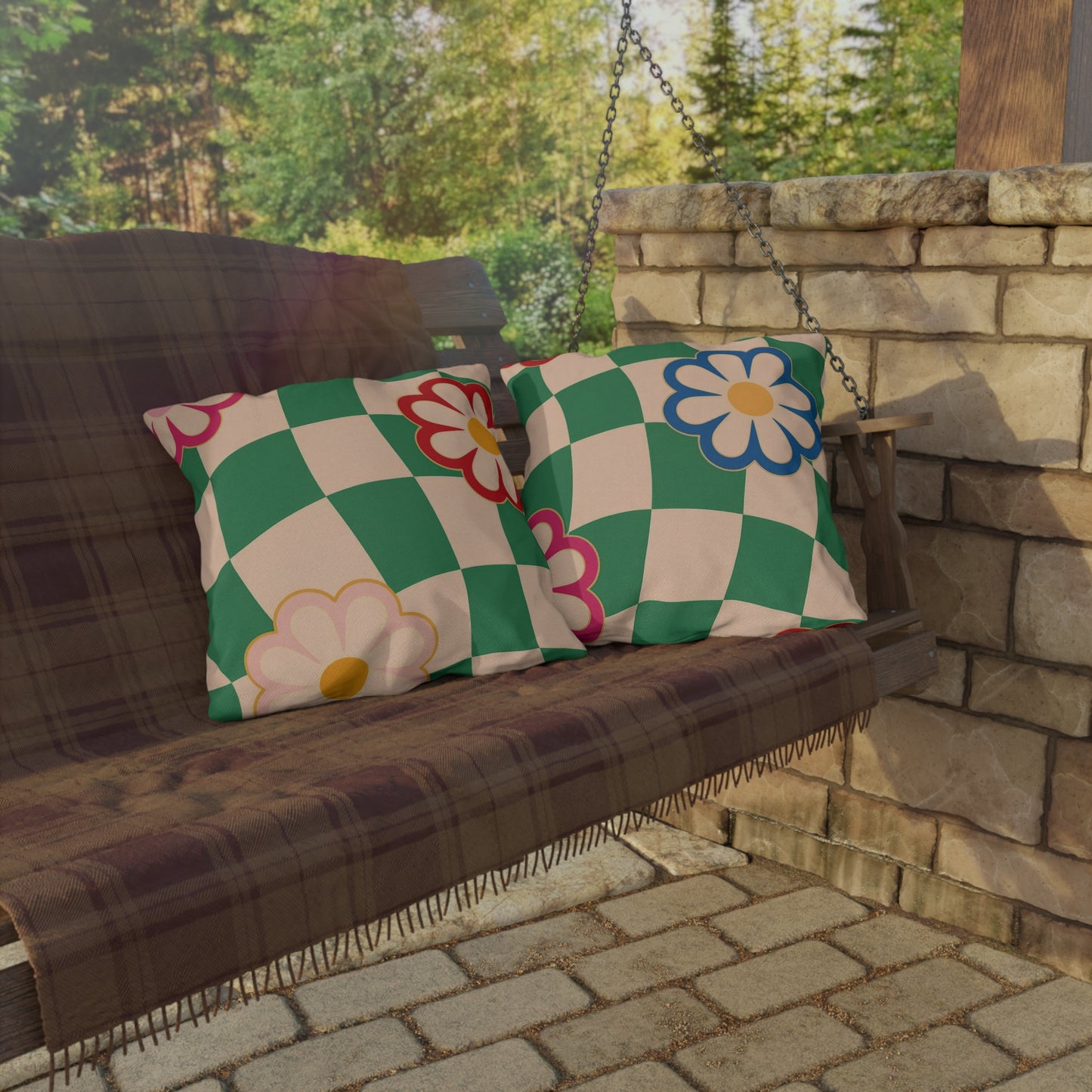 Vibrant flower print pillow placed on wooden deck furniture
