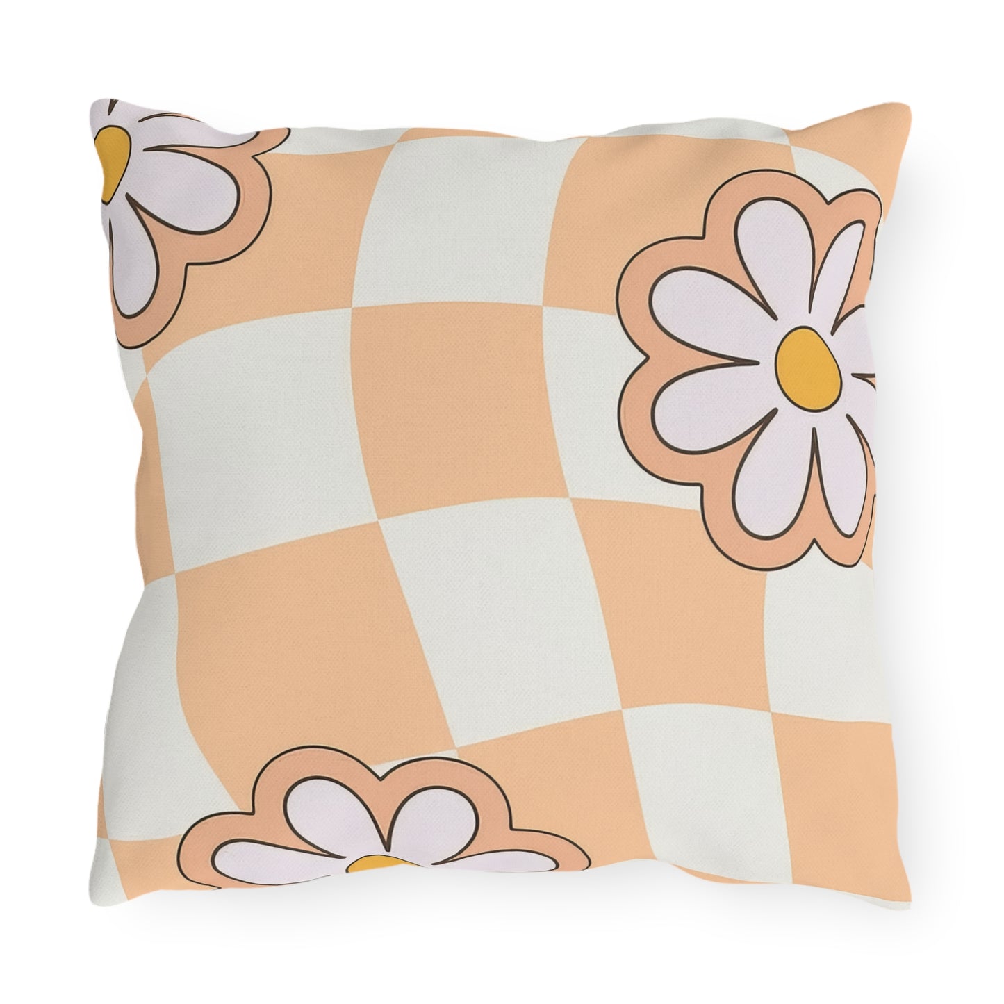 Decorative throw pillow with orange daisy design placed on a wooden deck chair