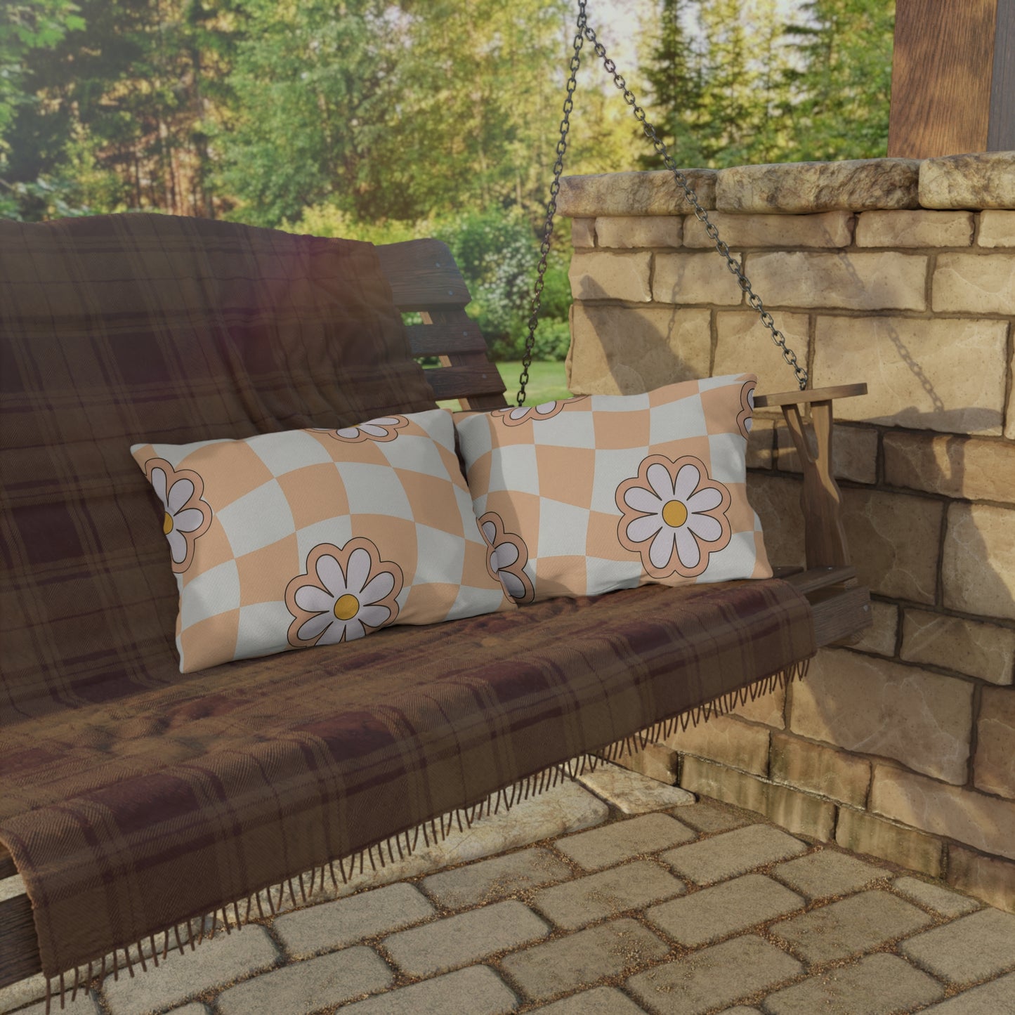 20x14 daisy print outdoor pillow with cream and orange flowers on porch swing