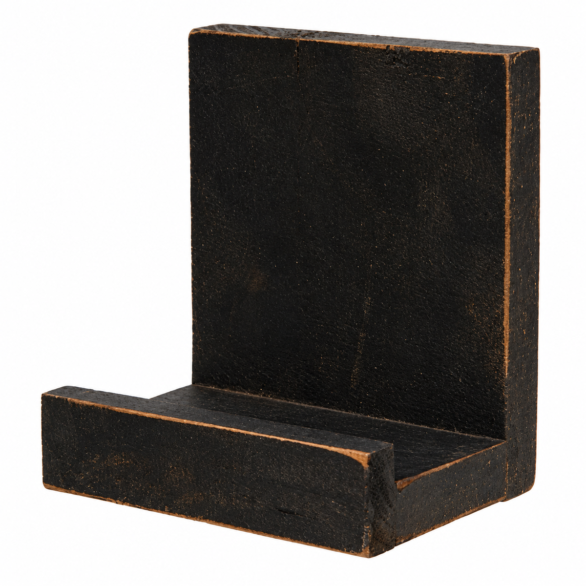 A rustic black painted wooden L-shaped bracket or shelf support with a distressed finish showing warm brown wood undertones, isolated on a white background.