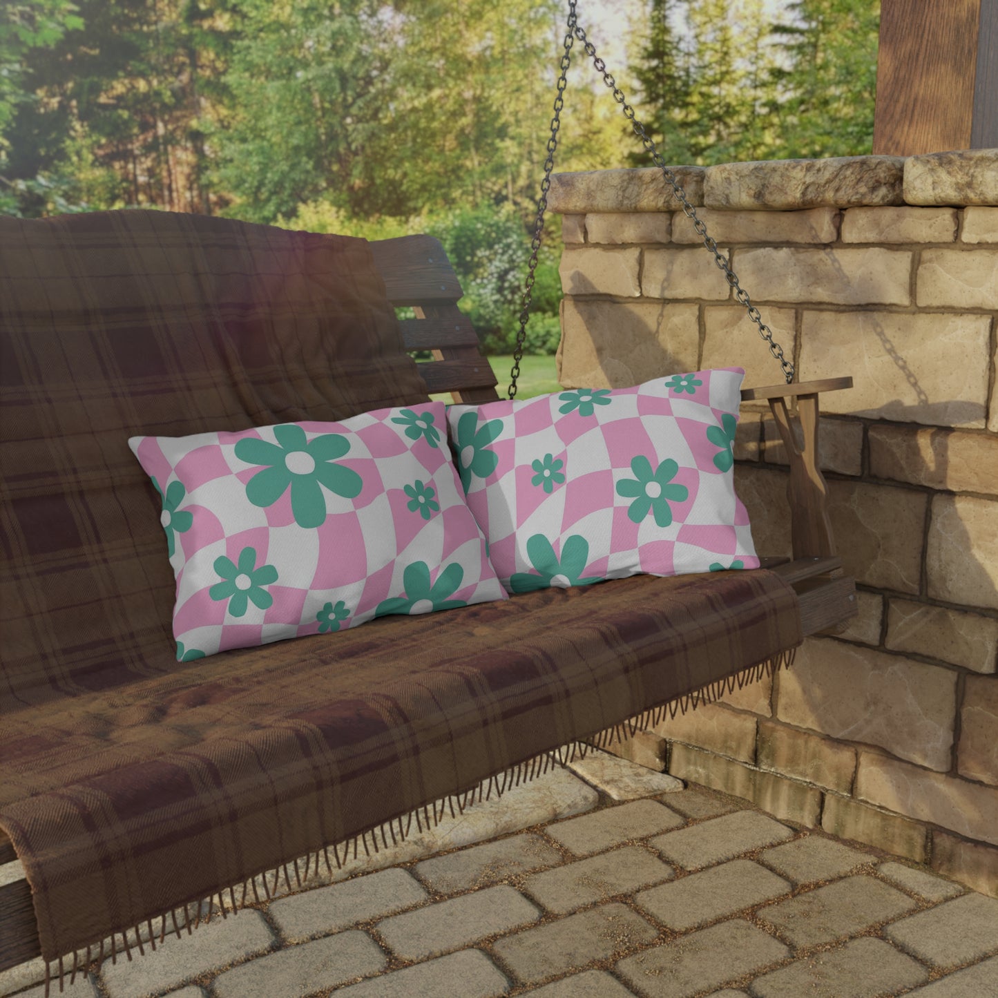 Cozy and colorful outdoor pillow featuring cheerful floral patterns, perfect for enhancing backyard spaces