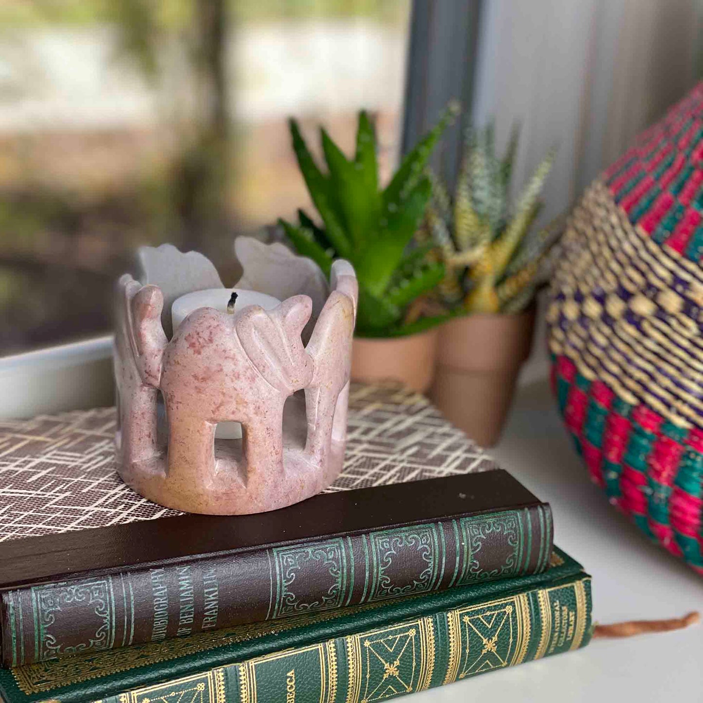 Elephant circle keepsake carved from cream and gold soapstone