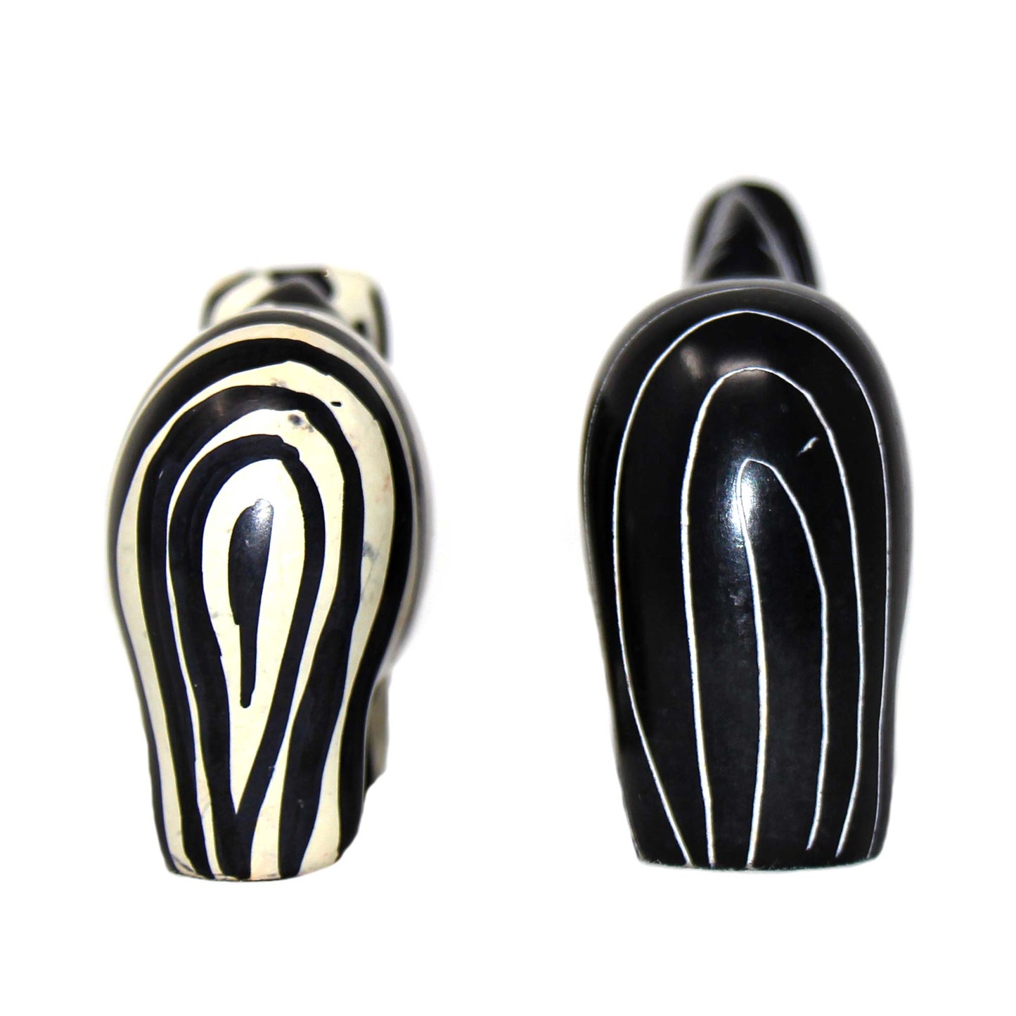 Artisan-crafted animal figurines in black and cream hues