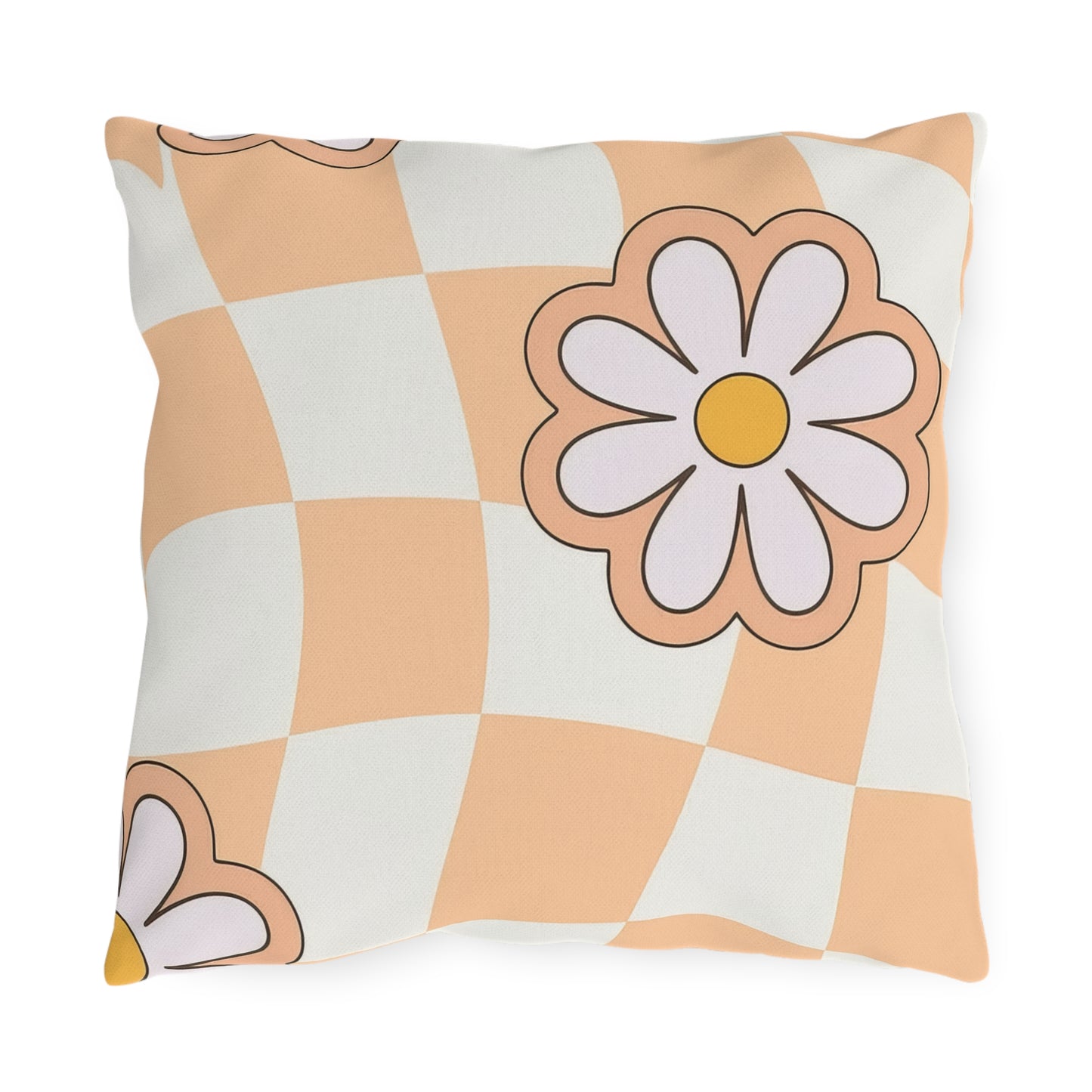 Square floral outdoor pillow with daisy pattern in orange, black, cream, and white on garden bench