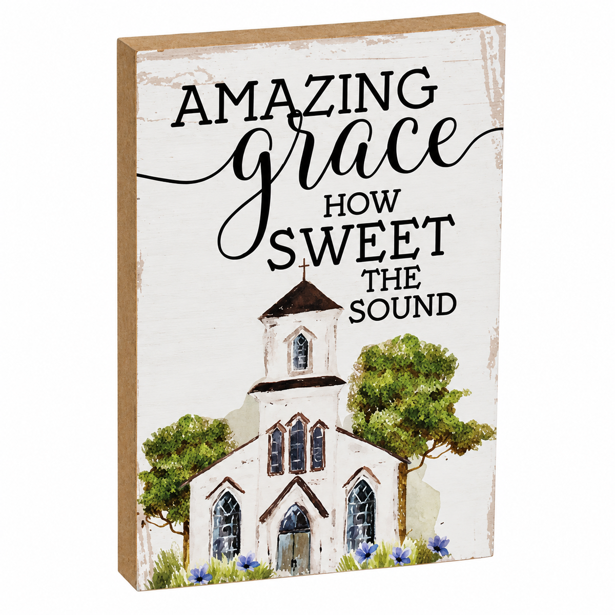 A rectangular decorative sign with a rustic white distressed background and brown wood edges, featuring the phrase “AMAZING grace HOW SWEET THE SOUND” above an illustrated church with trees and small flowers.