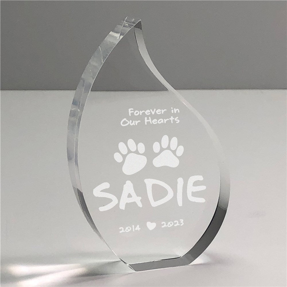 Personalized acrylic pet memorial keepsake with engraved name, birth year, and at rest year in a tear shape