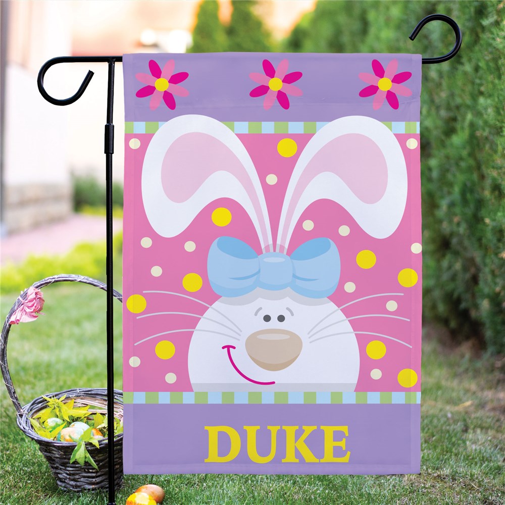 A festive Easter Bunny garden flag made of durable polyester, personalized with a family name for a unique seasonal touch.