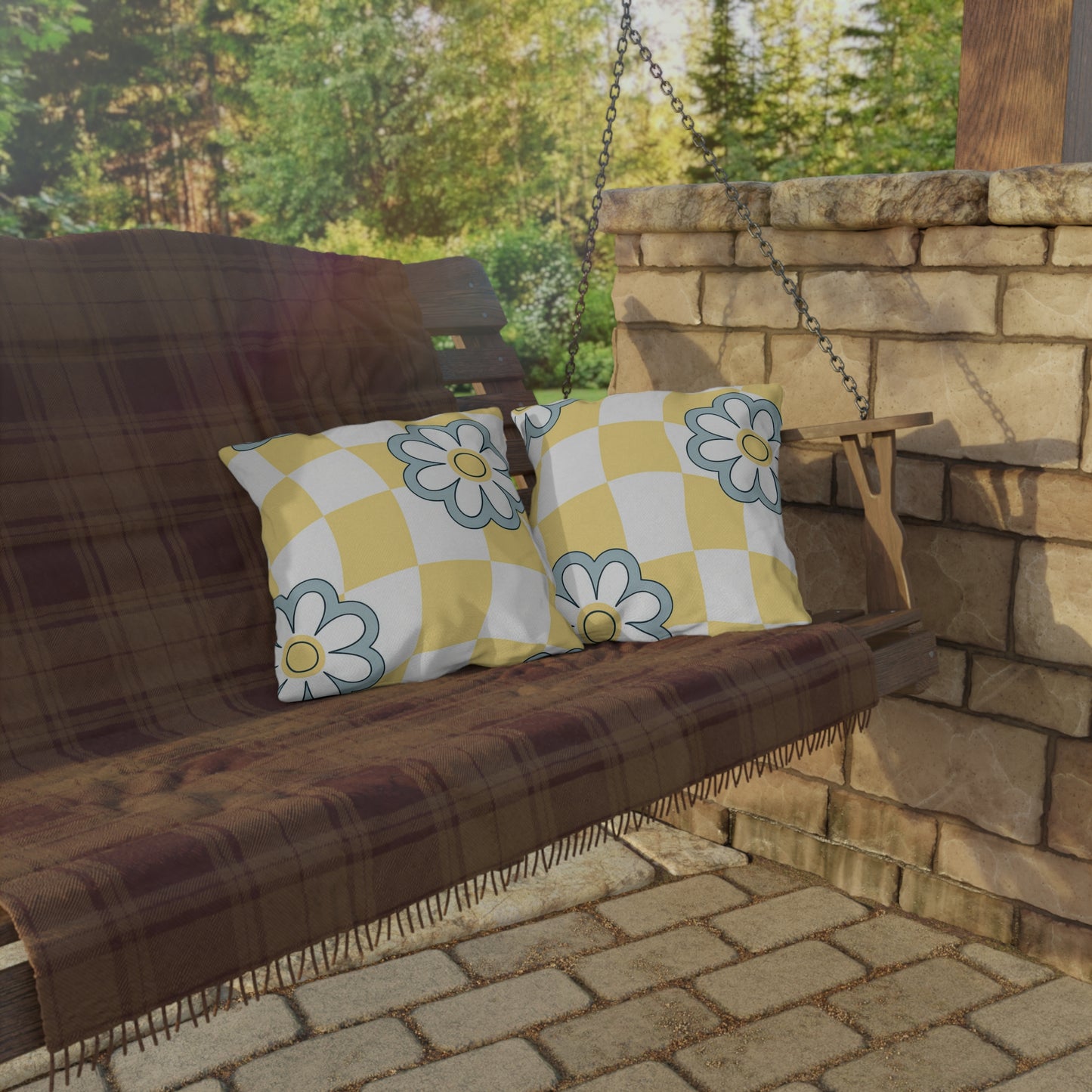 Cozy outdoor cushion with cheerful yellow background and daisy-style flower pattern