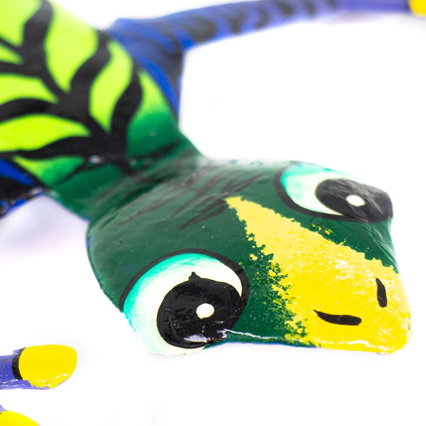 Handmade Haitian gecko decoration with vivid patterns and upcycled material