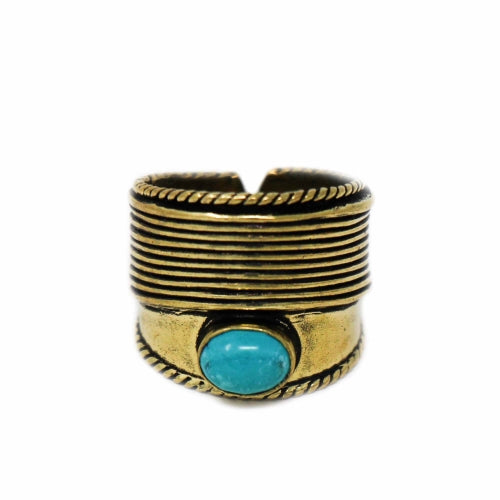 Turquoise stone brass ring styled with other boho accessories