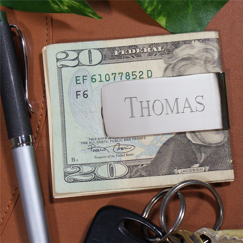 Personalized silver money clip with engraved initials, featuring a sleek, non-tarnishing nickel finish and compact design.