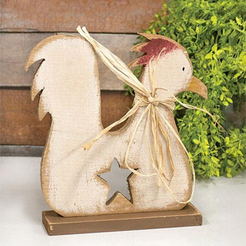 Rustic wood rooster figurine with distressed white paint, raffia bow, and star cut-out on brown base