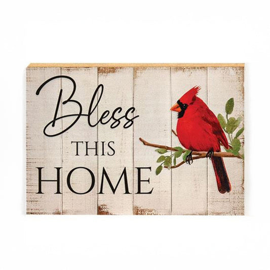 Wooden block sign with “Bless This Home” and red cardinal artwork on a distressed white shiplap background