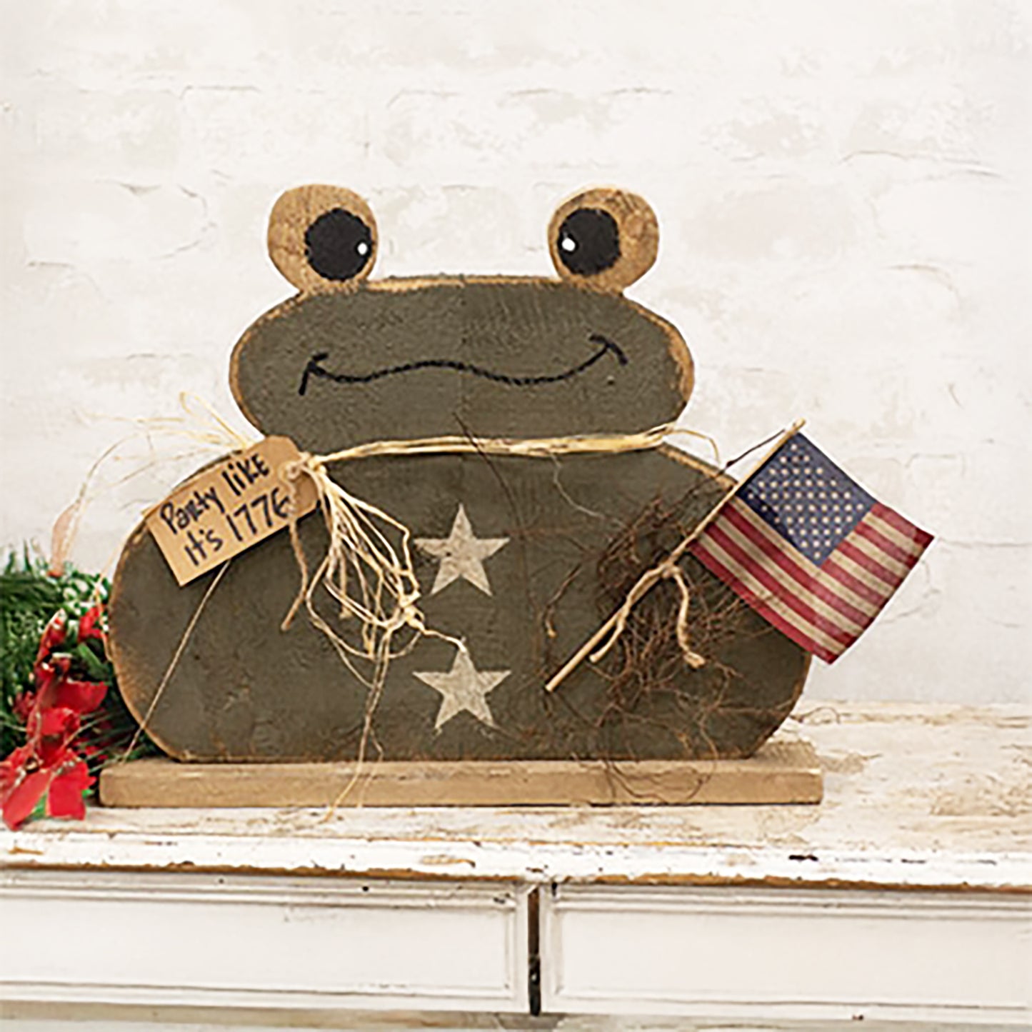 Rustic patriotic frog décor with American flag and distressed wood finish on freestanding base