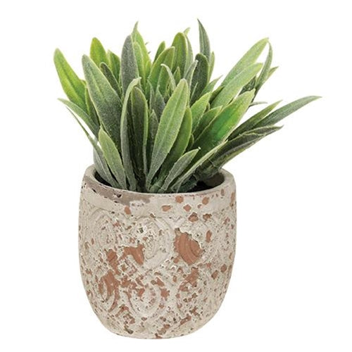 Faux greenery plant in rustic mini pot with aged terracotta tones