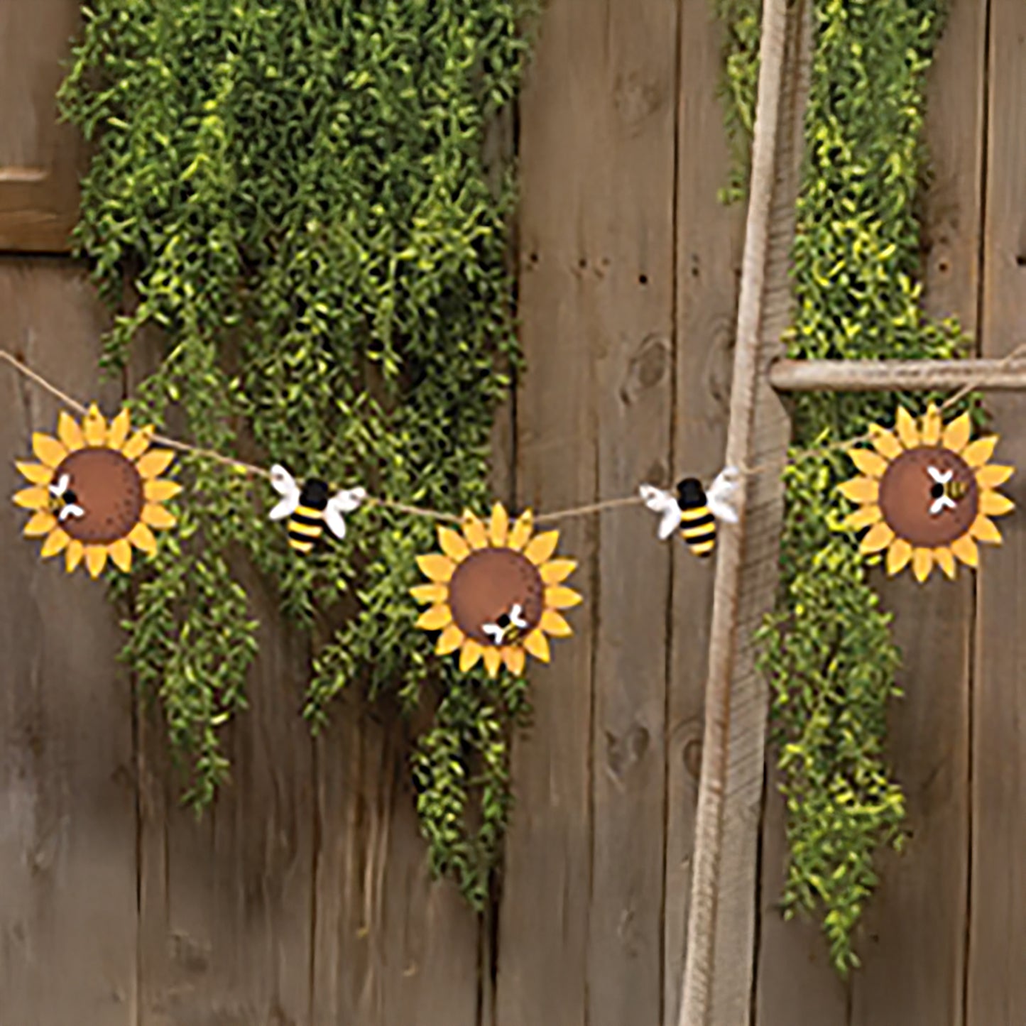 Wooden sunflower and bee garland on jute twine with rustic farmhouse details for summer decorating