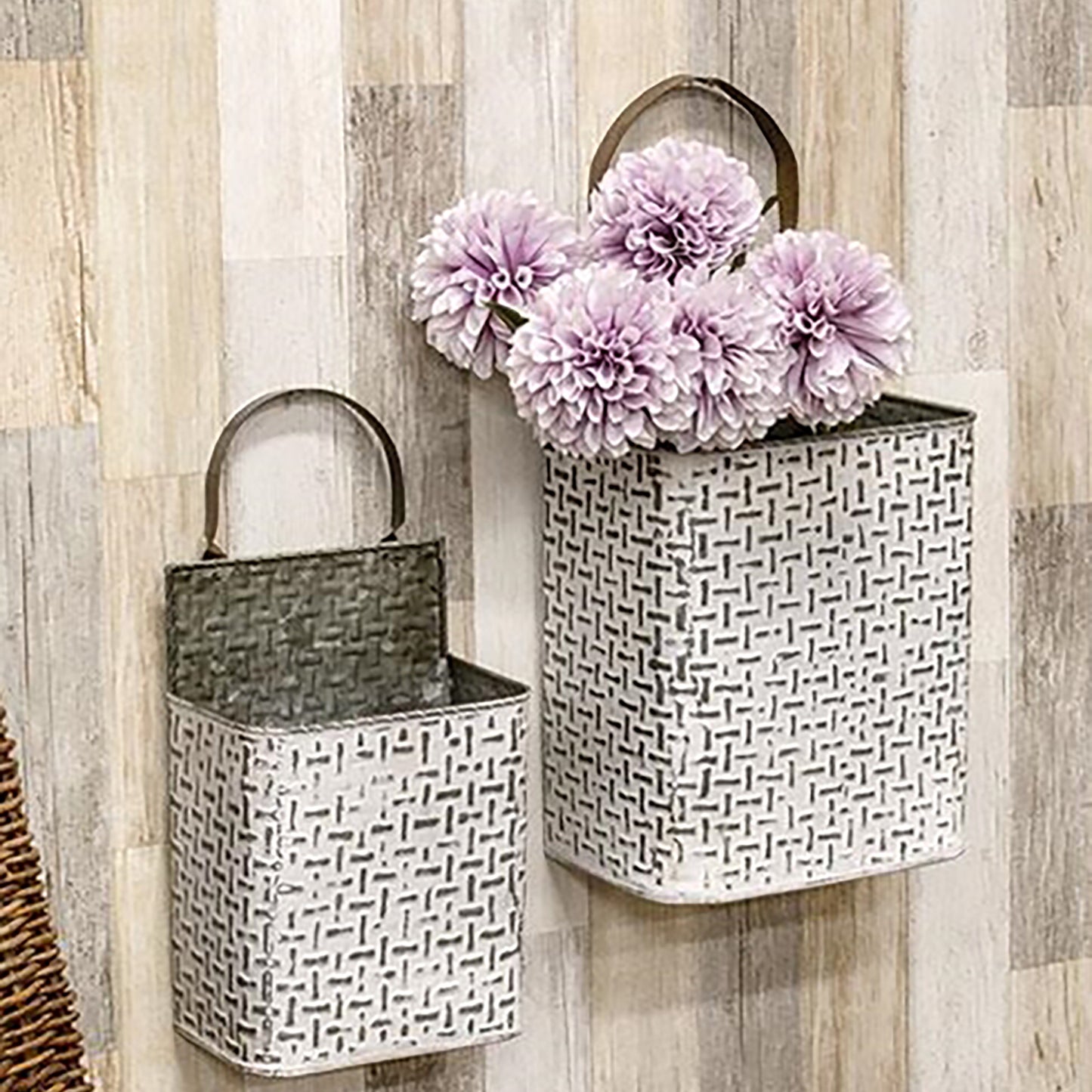 Set of two galvanized metal buckets with faux basketweave texture and white distressed finish