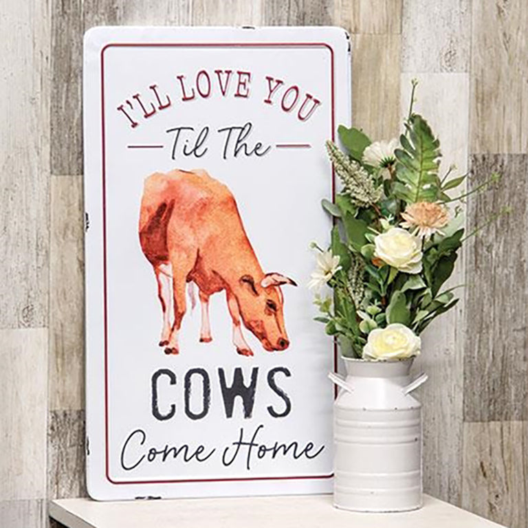 Farmhouse metal wall sign with cow illustration and the quote "I'll Love You Til The Cows Come Home" in red and black lettering.