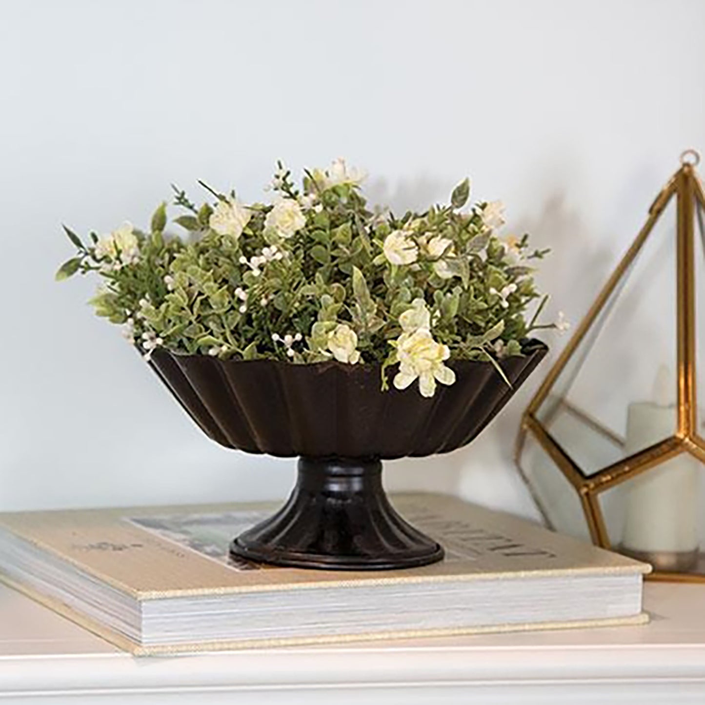 Small decorative urn bowl in matte black metal, perfect for seasonal filler or candles