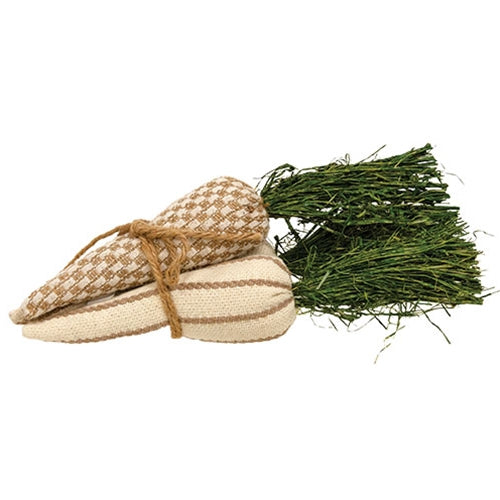 Neutral farmhouse carrots with raffia tops tied in jute ribbon