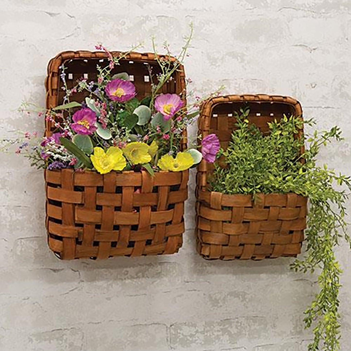 Set of two brown tobacco baskets with interwoven wood design and pocket shape