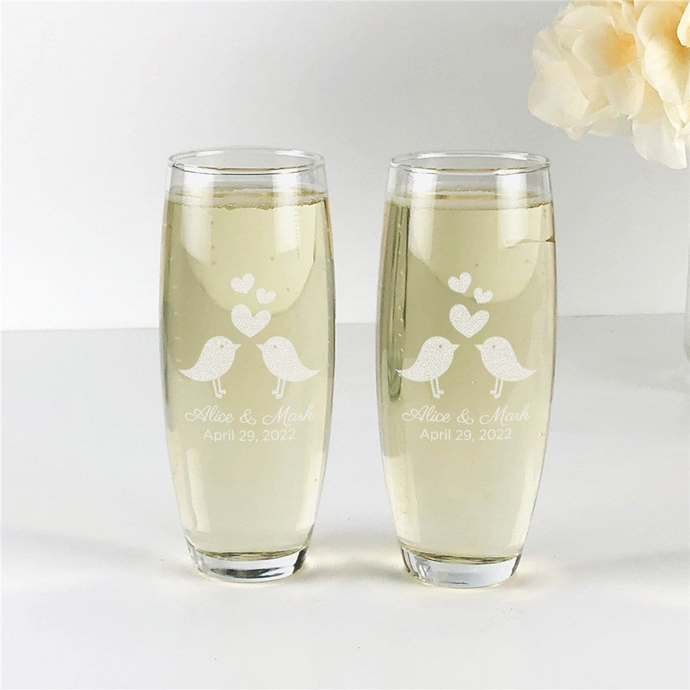 Engraved stemless champagne flute set with love birds design, personalized with couple’s names and date.