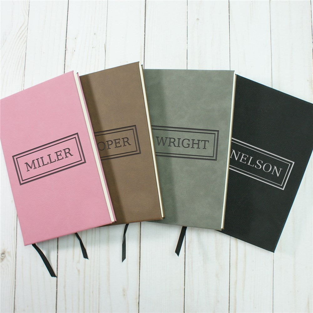 Personalized vegan leather journal with name and border, shown in pink with satin ribbon bookmark