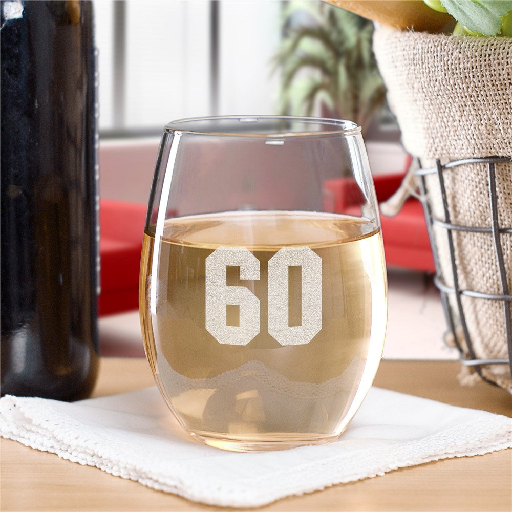 Stemless wine glass with engraved number in clear bold font, displayed on a neutral background