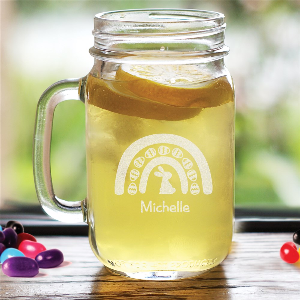 Engraved Easter rainbow mason jar with a curved handle, featuring a personalized name option, perfect for festive drinks and holiday gifts.