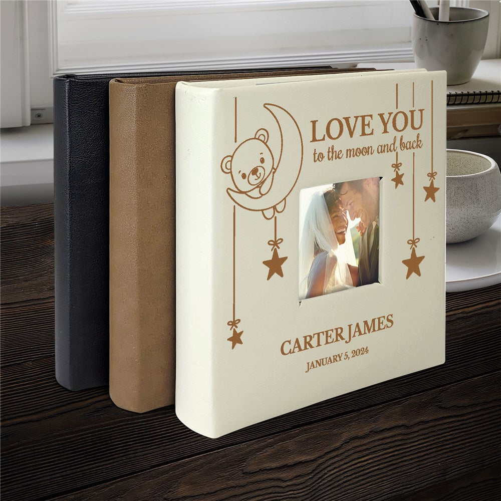 Engraved faux leather photo album with “Love you to the moon and back” and hanging stars, holds 200 4x6 photos