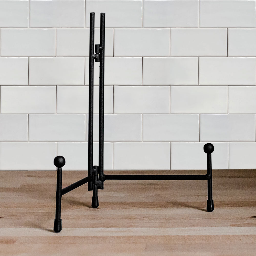 Metal black easel stand with folding design for displaying plaques, artwork, or framed items