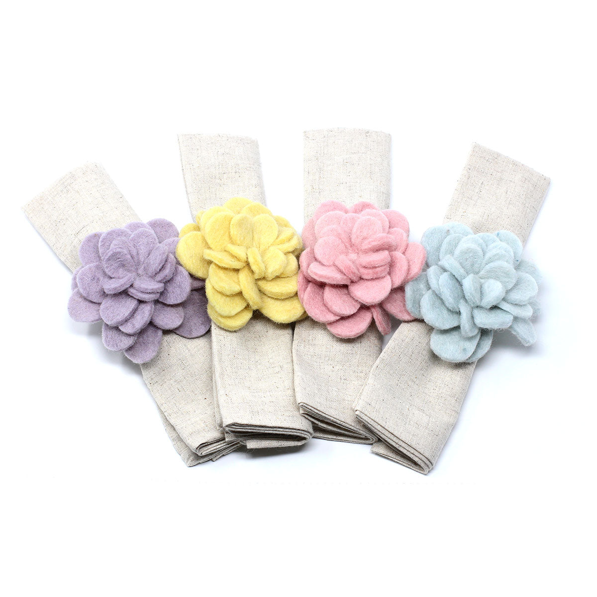 Hand-felted wool Zinnia napkin rings in a set of four colors, handmade in Nepal by fair trade artisans.