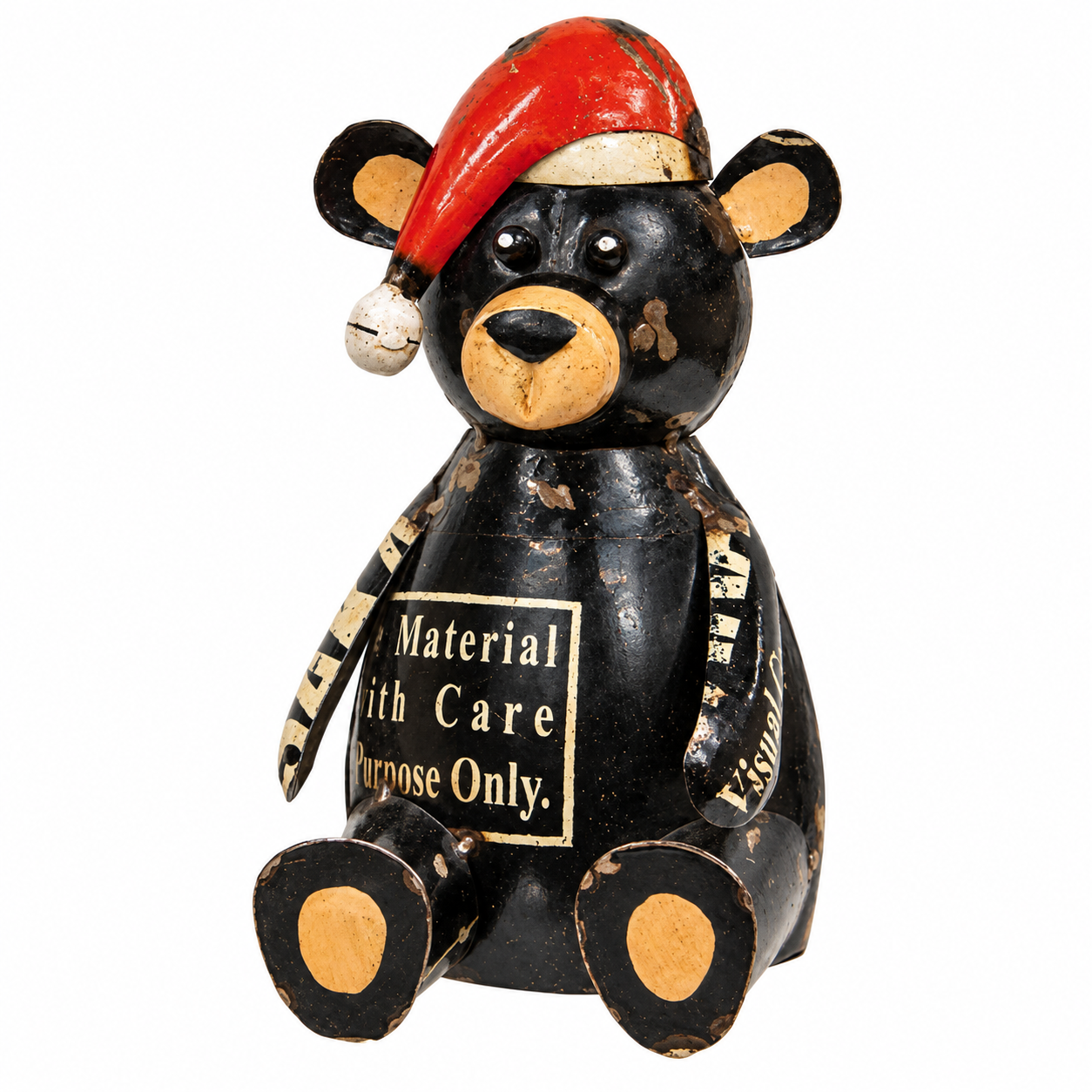 A vintage black wooden bear figurine wearing a red Santa hat, featuring a 'Material for Purpose Only' sign on its chest, set against a plain white background.