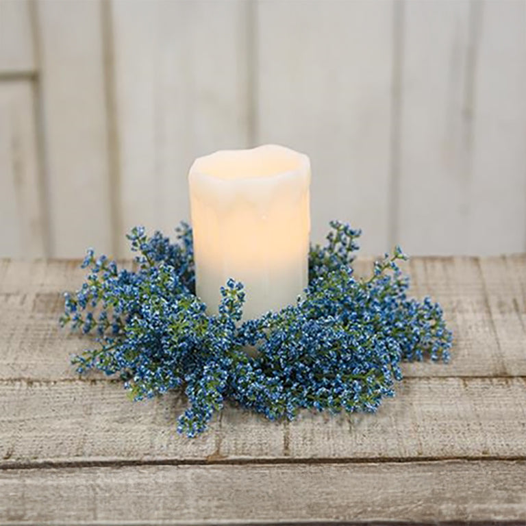 Decorative blue floral candle wreath with soft buds and lush faux greenery, ideal for mantels, risers, and seasonal tabletop accents
