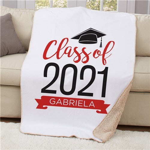 Customizable Sherpa blanket in red with a high school or college graduation theme, laid flat.