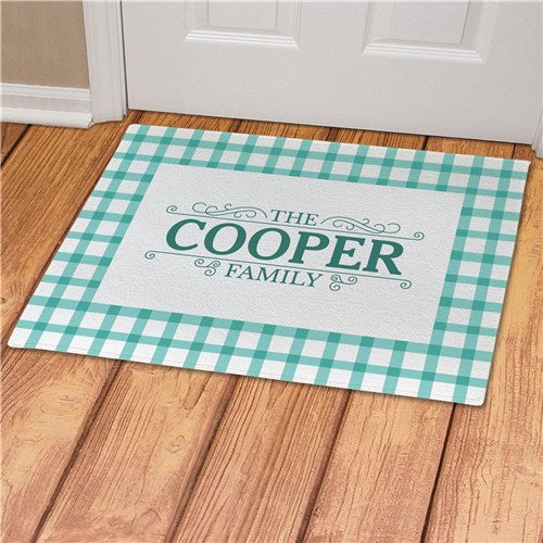 Personalized gingham floor mat with a fleece surface and durable latex backing. Adds a stylish and welcoming touch to any entryway.