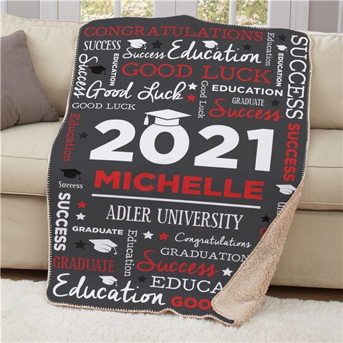 A cozy Personalized Word Art Graduation Sherpa Blanket draped over a chair, showcasing a custom name and year design in a stylish font.