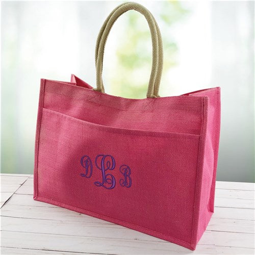 Hot pink personalized jute tote with shoulder straps and front pocket detail