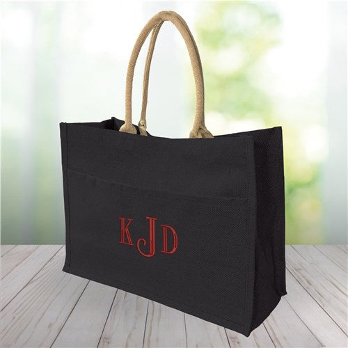 Black jute tote bag with personalized script monogram and magnetic closure