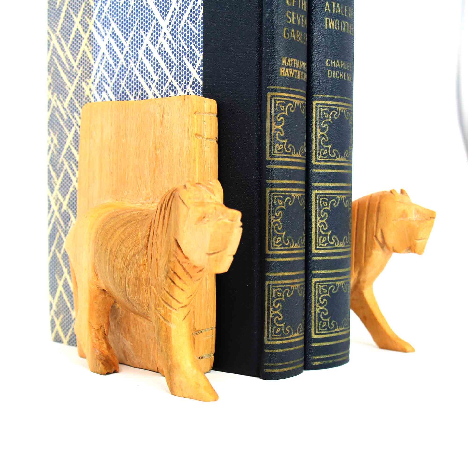 Side angle showing depth of carved lion face in bookend
