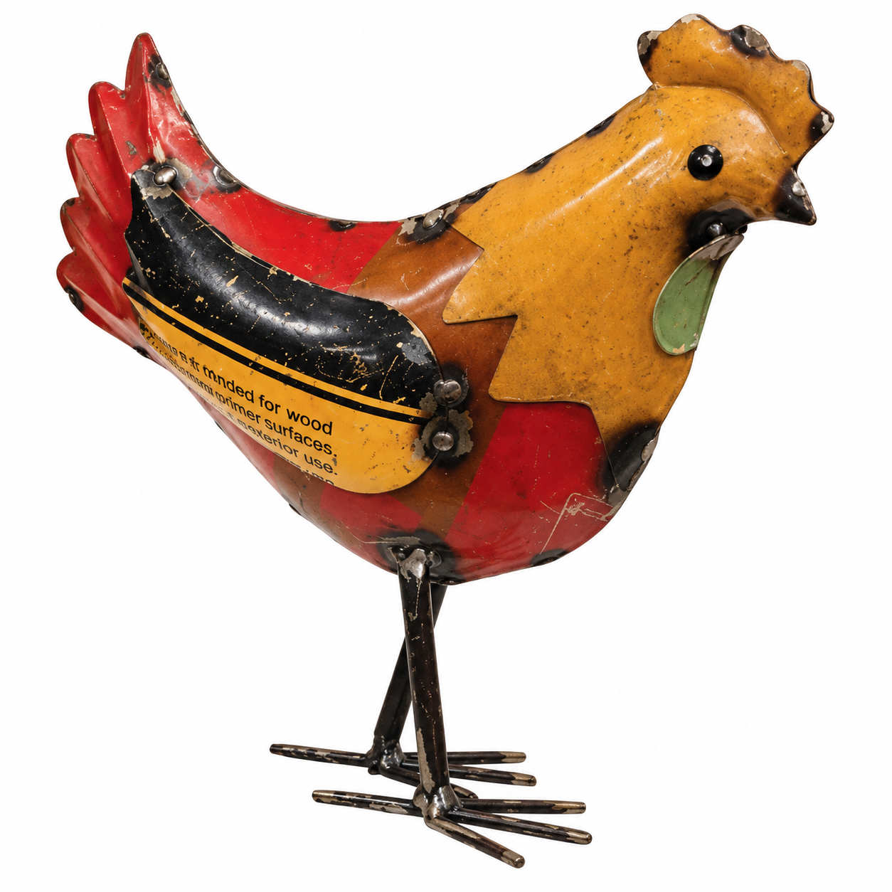 A colorful tin bird sculpture with a yellow head, red body, black wing, and dark metal legs, photographed on a plain white background.