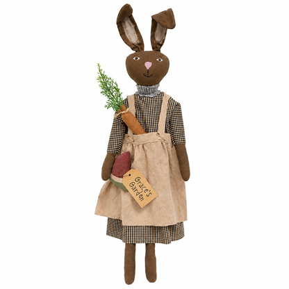 Grace’s Garden brown fabric bunny doll wearing a black-and-white gingham dress and taupe apron, holding garden accents with a “Grace’s Garden” tag, shown on a white background.