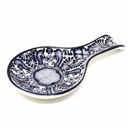 Decorative ceramic spoon rest for kitchen, hand-painted with vibrant blue floral patterns and a glossy finish.