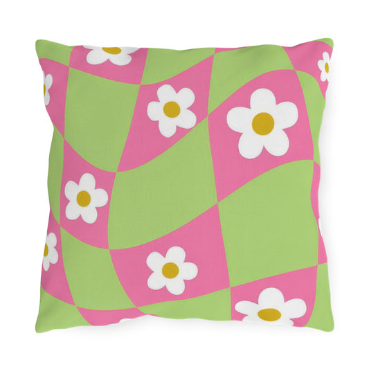 Cheerful floral patio pillow with pink and green blossoms for garden seating