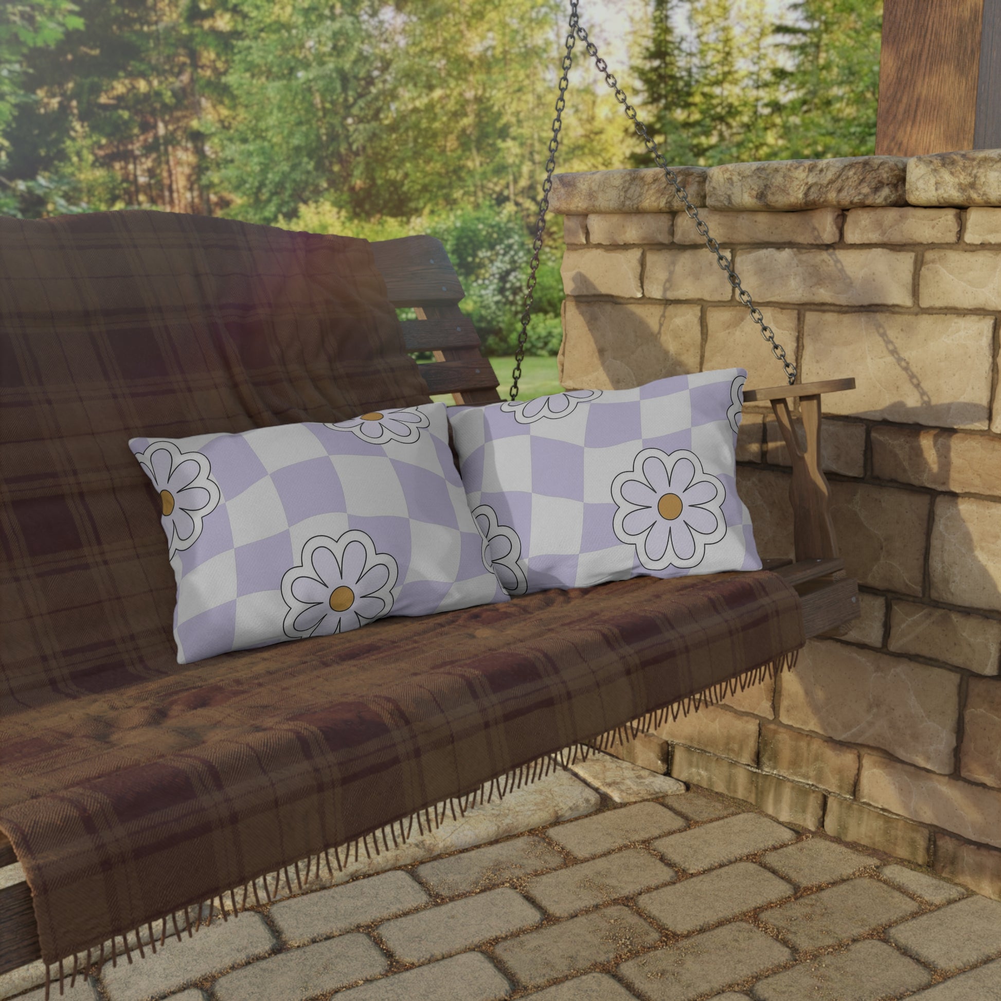 Close-up of floral print on lavender checkered pillow designed for outdoor use
