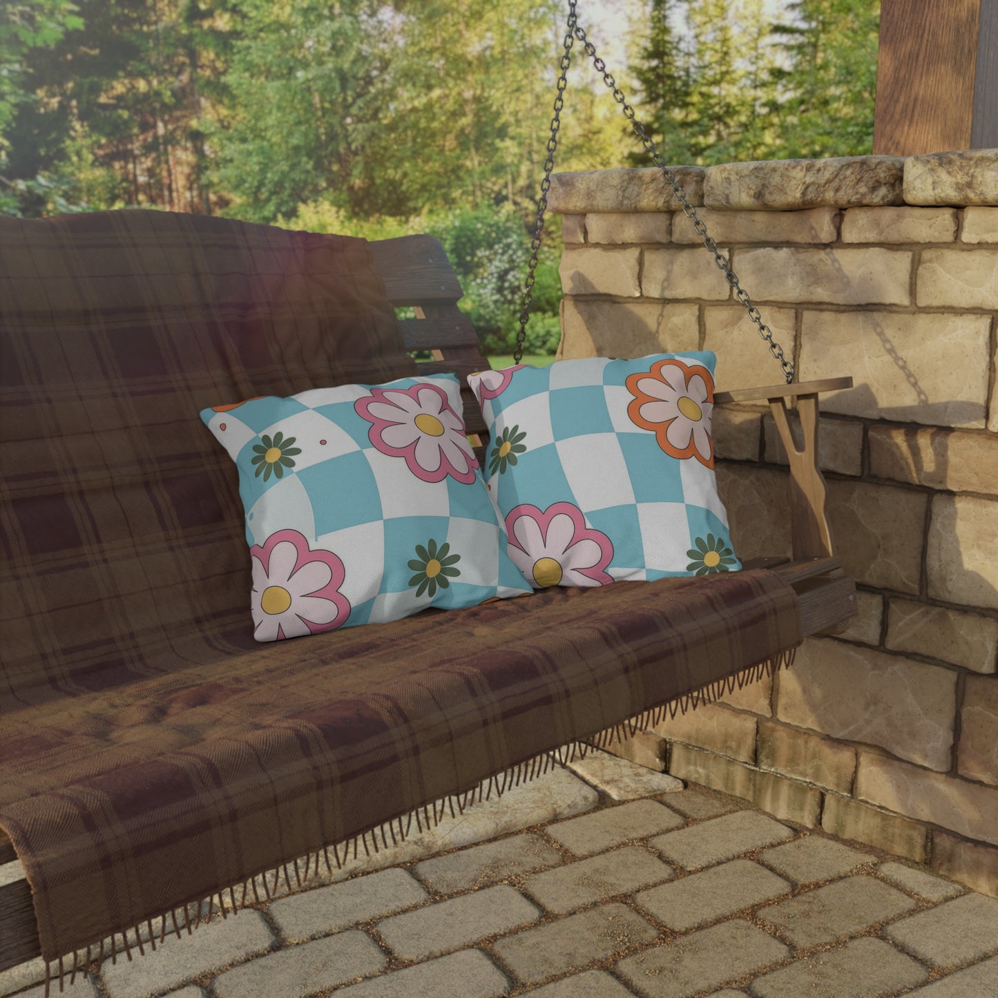 Cheerful garden pillow with multi-color floral print in backyard setup