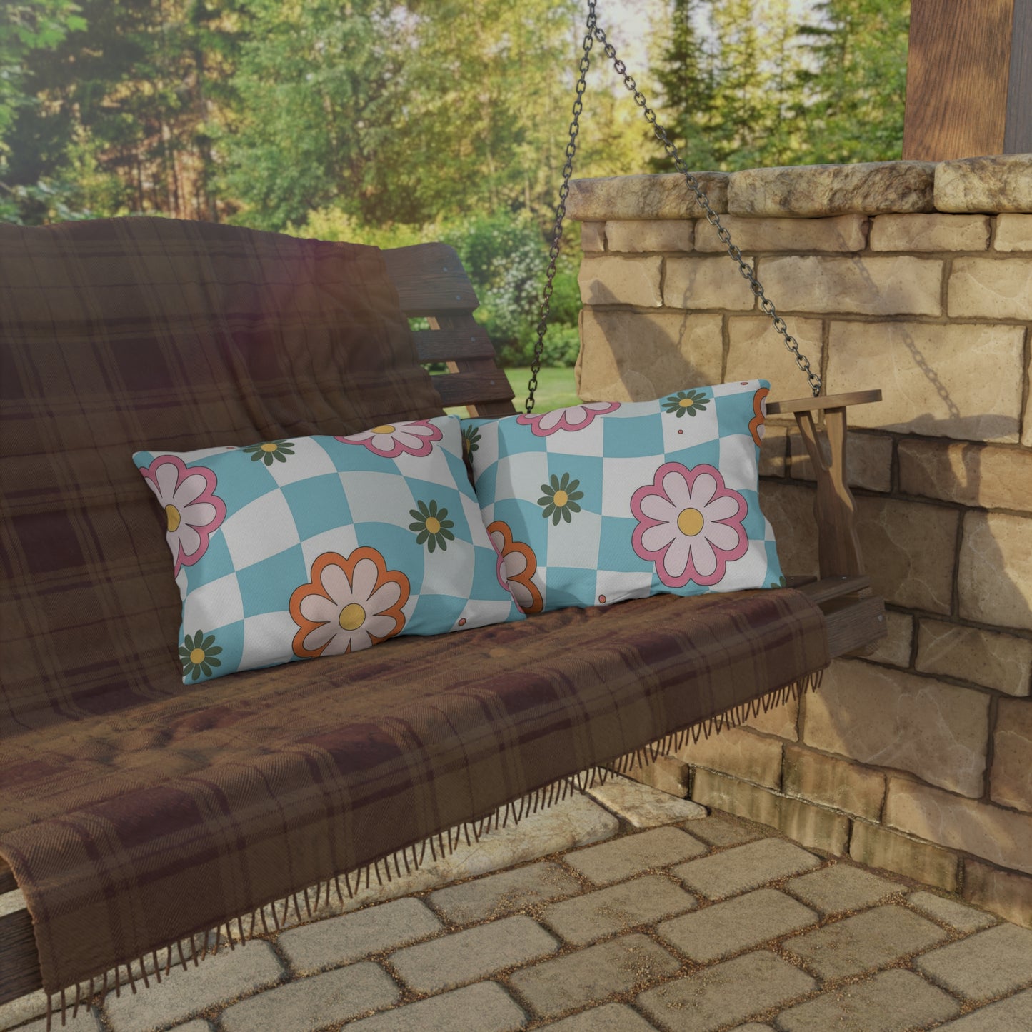 Decorative lumbar pillow with colorful botanical pattern in a bright garden setup