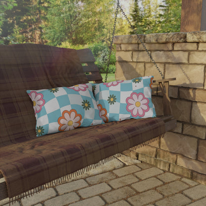Decorative lumbar pillow with colorful botanical pattern in a bright garden setup