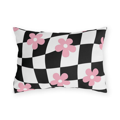 Decorative lumbar pillow with pink and white floral print on black and white checkered background