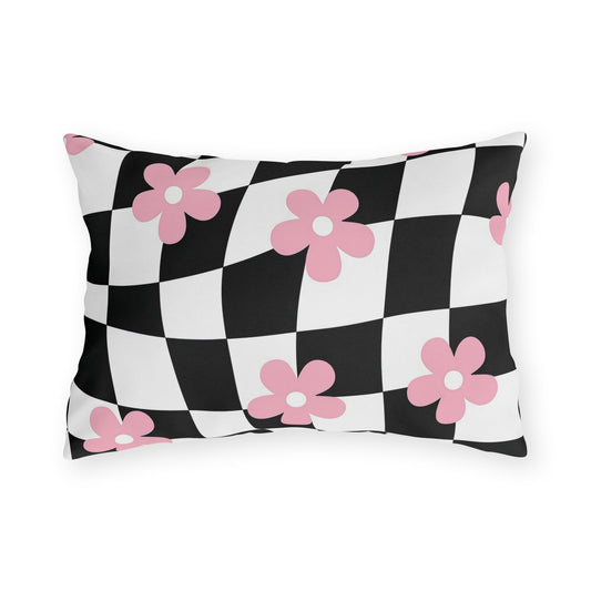 Decorative lumbar pillow with pink and white floral print on black and white checkered background